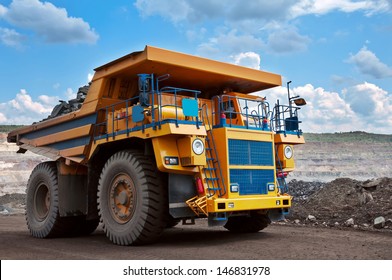 A Picture Of A Big Yellow Mining Truck At Work Site