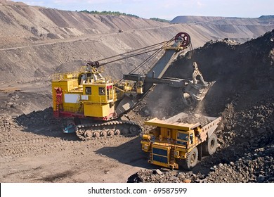 A picture of a big yellow mining truck at worksite