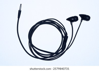Picture of a black color earphone isolated on white background