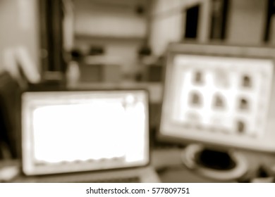 Picture blurred  for background abstract and can be illustration to article of Computer and laptop on the working place in the office