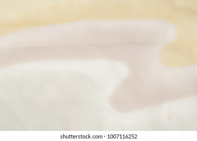 The picture is blurred. Background texture, drawing. Silk fabric. Light airy fabric. Beige, pastel colors. A good background for the screensaver