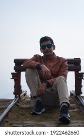 picture of boy sitting on high altitude area in himachal pradesh, India.