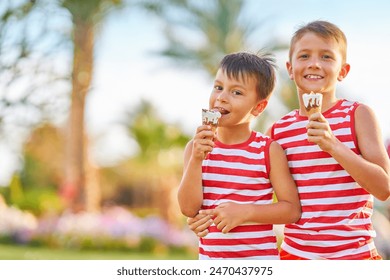 Picture of brothers with ice cream cone - Powered by Shutterstock