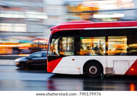 picture of a bus in city traffic in motion blur