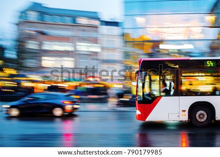 picture of a bus in city traffic in motion blur