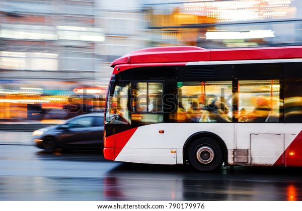 picture of a bus\
in city traffic in motion\
blur