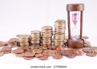 Picture of a Business Money Concept Idea Coins and Hourglass - Powered by Shutterstock