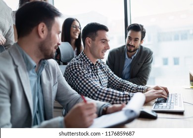 Picture of businesspeople working on computer together - Shutterstock ID 1176859687