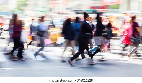 Picture With Camera Made Motion Blur Effect Of A Crowd Of People Crossing A City Street