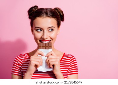 Picture of charming funny female break her diet plan eat yummy chocolate bar isolated on pink color background - Powered by Shutterstock