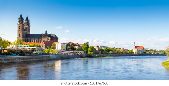 Picture of the City Viewfrom the River Elbe of Magdeburg with the Magdeburg Cathedral as Landmark and the Johannischurch in the further back, taken in Sping