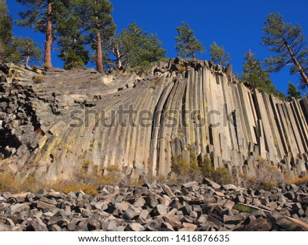 A picture of columnar basalt which is an igneous, volcanic rock formation located in the Devils Postpile National Monument in California.