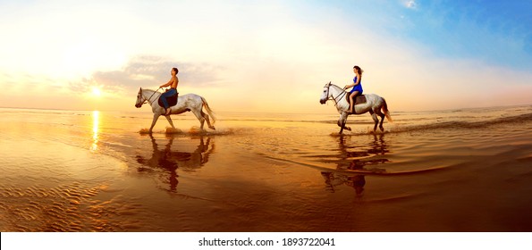 Picture a couple in love, which is galloping on a horse of the sea at sunset - Powered by Shutterstock