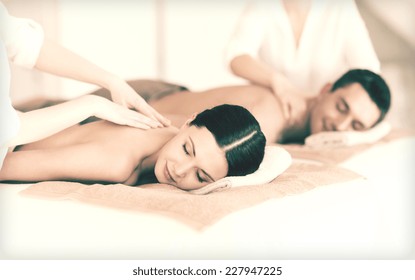 Picture Of Couple In Spa Salon Getting Massage