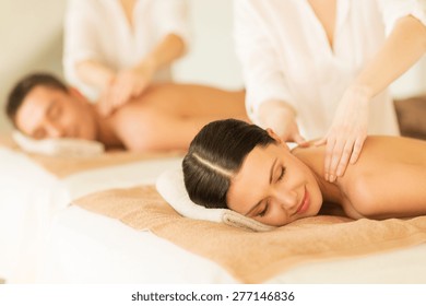 Picture Of Couple In Spa Salon Getting Massage