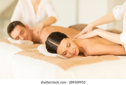 Picture Of Couple In Spa Salon Getting Massage