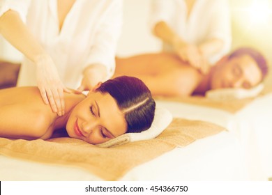 Picture Of Couple In Spa Salon Getting Massage