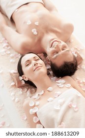 Picture Of Couple In Spa Salon Lying On The Massage Desks