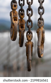 A Picture Of A Crane Hook Against The Sky.