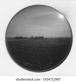 Picture Of A Crop Field, Taken From Outdoors, On A Pin Hole Camera, Focusing On The Center Of The Frame