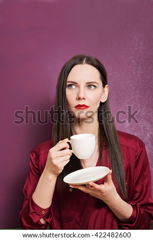 picture of cute young woman with cup of coffee