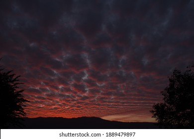 picture of dark pink blue clouds and mountain in evening. himachal pradesh india.