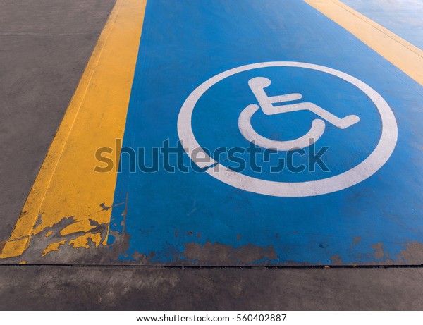 Picture of\
disability symbol painted on the\
floor