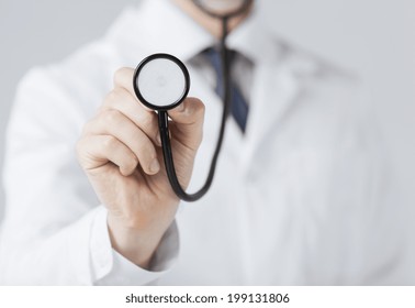 picture of doctor hand with stethoscope listening something