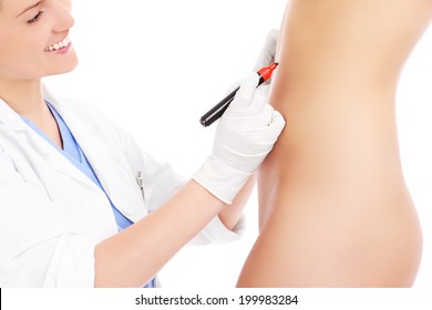 A Picture Of A Doctor Marking Abdomen For Plastic Surgery