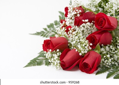 Picture of a dozen Red Roses on white background with space left for copy
