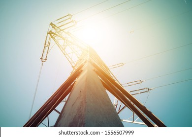 Picture Of An Electrical Tower Or Pylon, Blue Sky In The Background. Power Grid Or Smart Grid. 