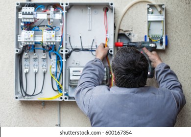 Picture Of An Electrician Fixing An Electric Fuse At Home