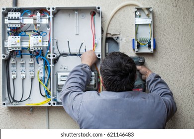 Picture Of An Electrician Fixing An Electric Fuse At Home