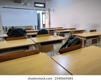 A picture explain the condition of an empty classroom during a break session - Powered by Shutterstock - Get 15% off with code: PIKWIZARD15
