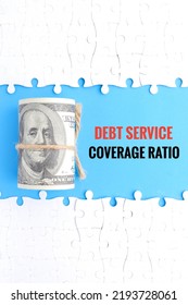 A Picture Of Fake Money And Debt Service Coverage Ratio Word With Puzzle Insight.