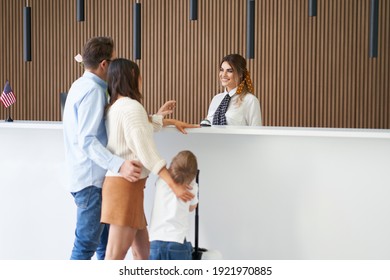 Picture Of Family Checking In Hotel