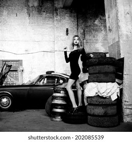 Picture Of Fashionable Woman In Retro Garage