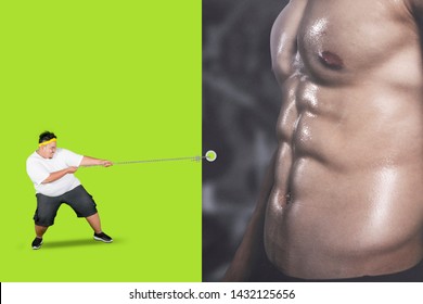 Picture of fat man struggling to get his dream while pulling a banner with muscular belly - Powered by Shutterstock