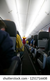 Picture Of Female Air Hostess Demonstration How To Put Life Jacket From The Back Side