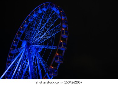 Picture of ferris wheel against background of night sky
