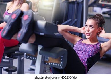 Picture Of Fit Woman Doing Sit Ups In Gym