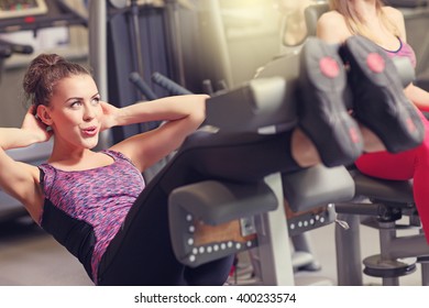 Picture Of Fit Woman Doing Sit Ups In Gym