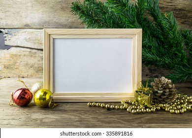 Picture Frame And Christmas Decorations On Old Wooden Background. 