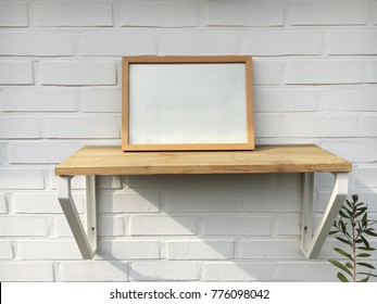 Picture Frame On Shelf On Wall