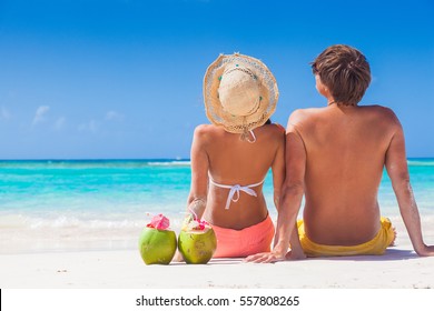picture of fresh coconut juice and sunglasses on tropical beach