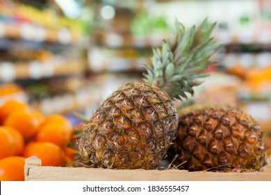 Picture Of Fresh Taste Pineapples On Counter In Food Market, No People