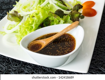 Picture of fresh vegetable salad and dressing in Japanese style - Shutterstock ID 142418689