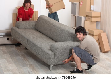 Picture Of Friends Moving A Couch