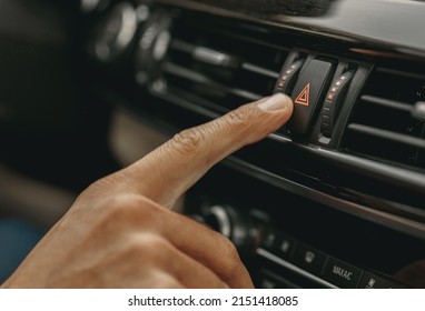 Picture Of Hand Pressing Red Triangle Car Hazard Warning Button