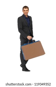 Picture Of Handsome Man In Suit With Shopping Bags.